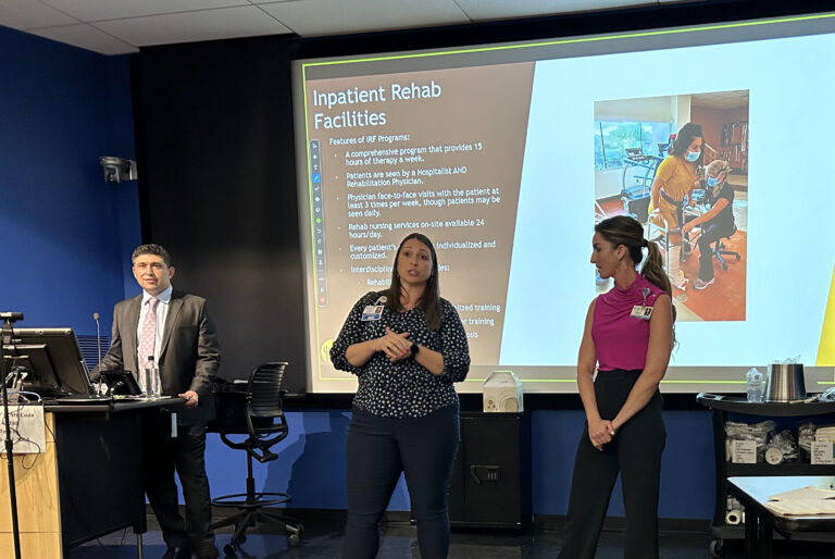 Dr. Kiyan Rad at the podium with two rehabilitation nurse leaders presenting a continuing medical education lecture on inpatient rehab facilities in Tucson