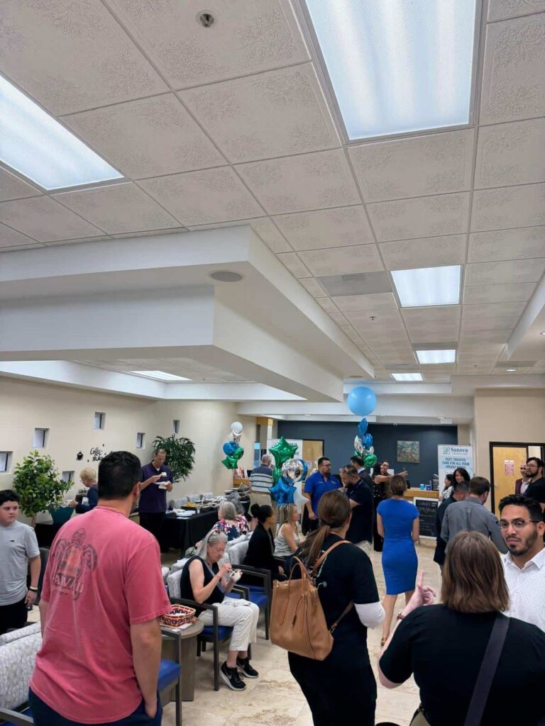 Crowd of guests at the Sanova Urgent Care open house in the clinic lobby