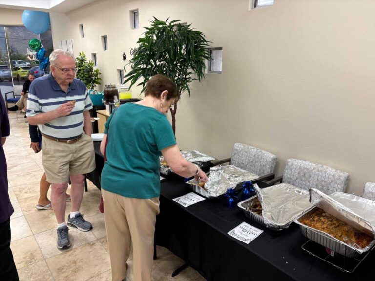 Guests enjoying refreshments at the Sanova Urgent Care open house in Catalina