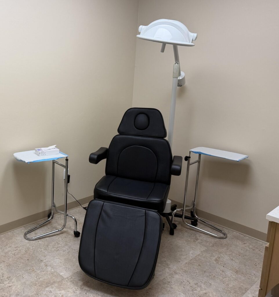 Procedure chair and exam light at Sanova Urgent Care, where abscess drainage and skin infection treatment are done on a walk-in basis