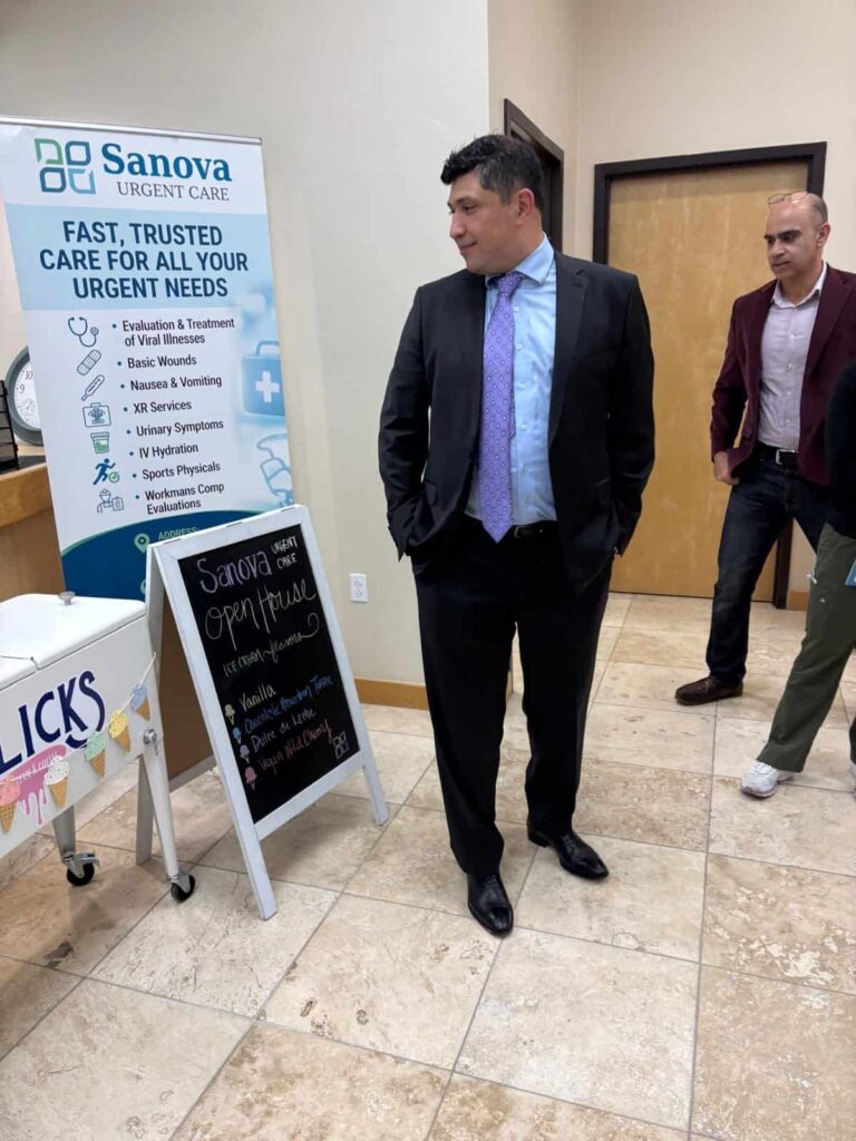 Sanova Urgent Care sign reading fast, trusted care for all your urgent needs, with guests in the lobby at 15883 N Oracle Rd, Ste 101, Tucson, AZ 85739