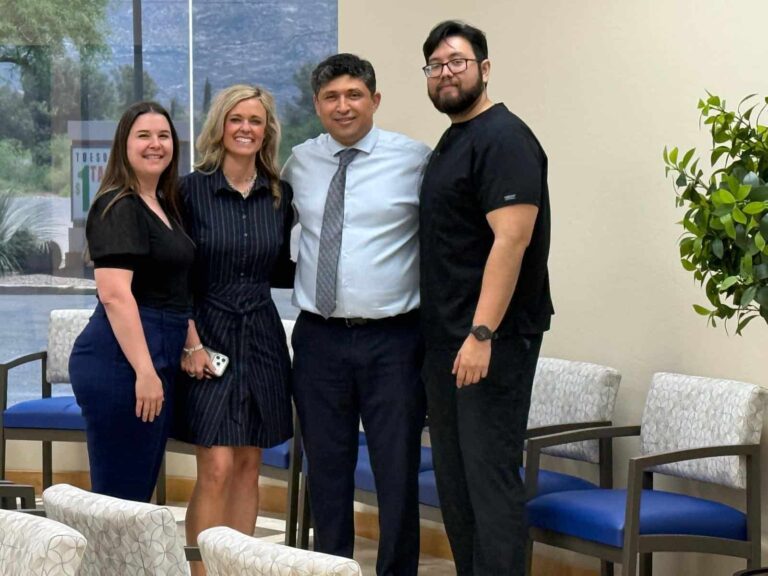 Dr. Kiyan Rad with Stacie, a Hanger Clinic executive, in the Sanova Urgent Care lobby at 15883 N Oracle Rd, Ste 101, Tucson, AZ 85739, coordinating orthotic and bracing care for patients