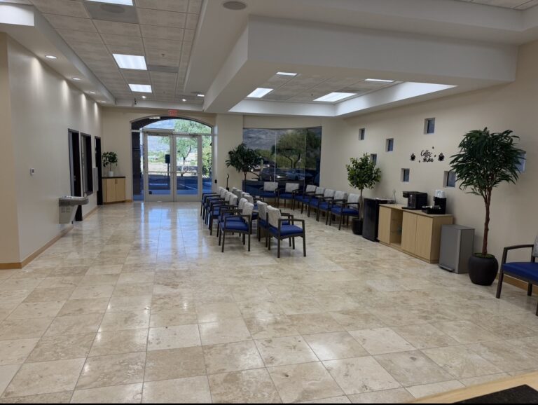 Bright waiting room at Sanova Urgent Care in Catalina, AZ with TV, cold bottled water and coffee bar